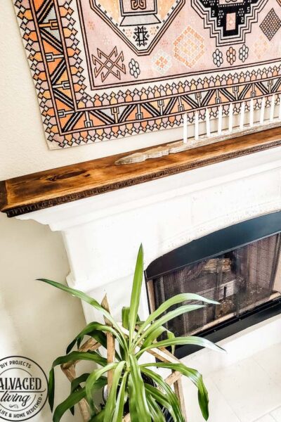 See how to make a stone fireplace mantel into a wood fireplace mantel. This DIY mantel idea is perfect for the person who loves to decorate their mantel but struggles with how to hang deocr on stone mantel or concrete mantel. It is an easy fireplace fix for a more functional fireplace mantel. #woodmantel #DIYmantel #manteldecor #stonefireplaceidea