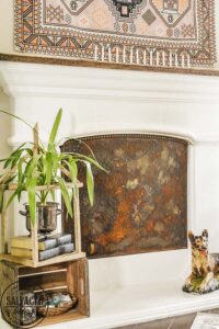 how to make your own DIY fireplace insert custom to fit your fireplace and stop those nasty drafts. Plus this fireplace screen is so pretty in the non winter months when you don't burn a fire in your fireplace! Plus you get a tutorial on how to make things rust. I love a rusty transformation. #DIYrust #firplaceinsert #fireplacescreen #summerfireplace