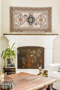 Learn how to make a custom fireplace insert to cover your fireplace opening when you aren't using it for fire. I will show you how to make almost any surface rusty for a vintage fireplace insert that is custom fit to your hearth. This stunning DIY decor project looks so high end and vintage, you will love it. #modernmasters #modernmastersmetaleffects #metaleffects #fireplacedecor #interiordecor #springrefresh #oxidizedfinish #sponsored