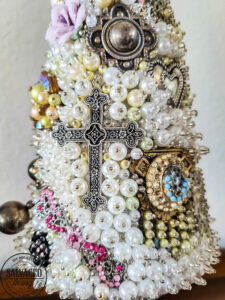 cross on vintage jewelry tree