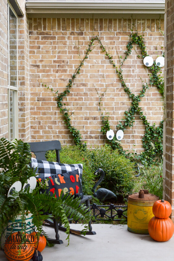 Create a spooky porch for Halloween with DIY glow-in-the-dark outdoor Halloween decor. Perfect for your plants and yard, these glow in the dark eyes bring your outdoor decorating to life! #rustoleum #rustoleumimagine #glowinthedark #halloween #halloweendecor #sponsored #outdoordecor #DIYHalloweencraft