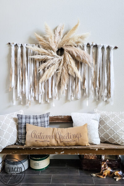Learn how to make the large scale wall hanging I use in my living room. This shabby chic wall art is perfect fora large space or make it small and DIY this idea to fit your needs. Using an old sheet, burlap and drop cloth you can create a boho wall hanging in no time. #dropclothcraft #walldecor #wallartideas #DIYbohodecor
