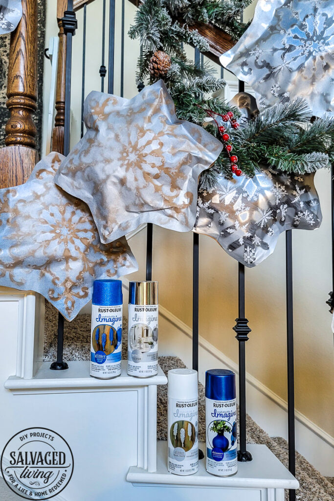 This simple DIY snowflake garland from dollar store felt pieces and Rust-Oleum Imagine spray paint is the perfect winter wonderland addition. Bring a flurry of snow to your holiday home decor with a papercraft for any decor style. The perfect DIY staircase decorating idea for your holiday banister! #rustoleum #rustoleumimagine #snowflake #winterwonderland #holidaydecor #holidaydecorating #christmasdecor #sponsored #staircasedecor 