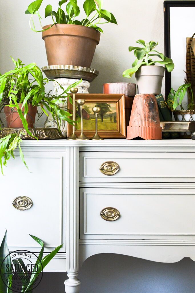 Found this vintage buffet side board at a garage sale and am sharing how to makeover a buffet! There are a few furniture painting tips along with some how to styling tips and inspiration for you here! ENjoy. #thriftedfurniture #paintedfurniture #vintagestyle #vignettestyling #painting tips #decortips