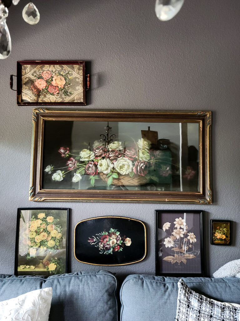 Floral gallery wall inspiration thrifted vintage floral art makes a beautiful focal point for a feminine moody aesthetic. #floralart #thriftedart #gallerywall