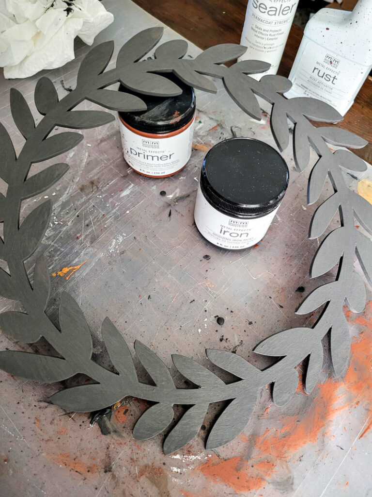 Learn how to rust wood or rust any surface with this amazing product and technique. Rust new things like wood and dollar store bells for gorgeous decor that feels old and vintage. You can make new things old with rust! #DIYdecor #rustychippy #rustfinish #painting technique #paintideas