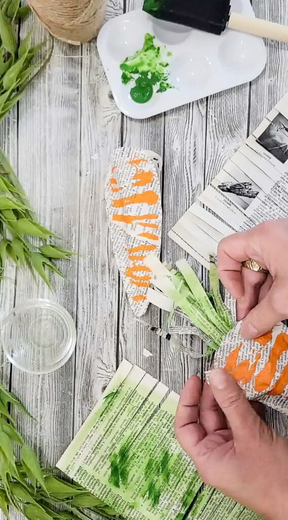 Using just a few simple supplies, you can make these gorgeous stuffed carrots for Easter and use them for years to come! #papercraft #easterdiy #budgetfriendlyeasterdecor #paperdiy