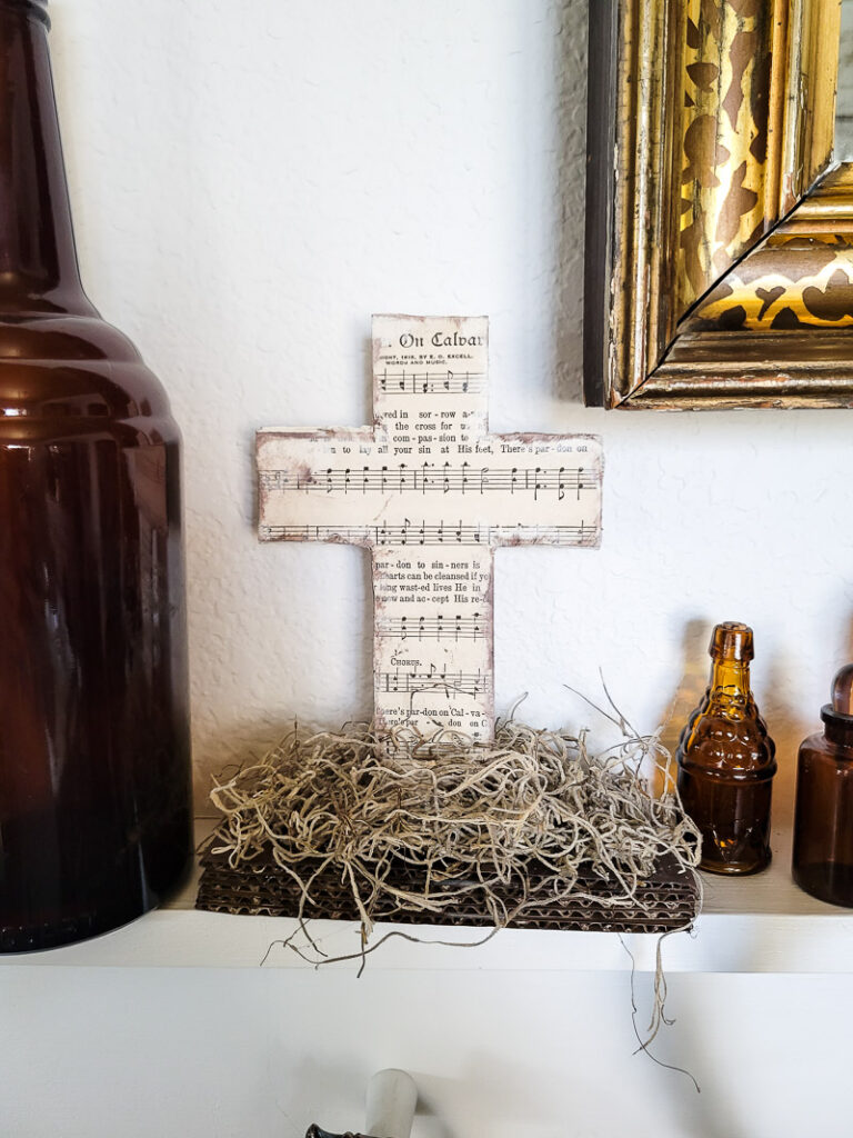 Create beautiful cross decor with only cardboard and a couple supplies! It's easier than you might think!! #cardboardcraft #easydiy #budgetfriendly #cardboard #cross #faith