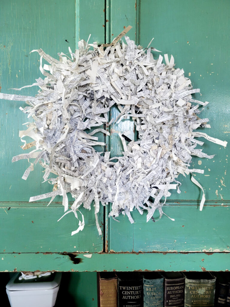 This is the easiest paper craft! Make a precious shredded paper wreath from paper and cardboard. Add a vintage feel to your home on a super tight budget. This decor project literally cost close to nothing! #DIYwreath #cardboardwreath #paperwreath