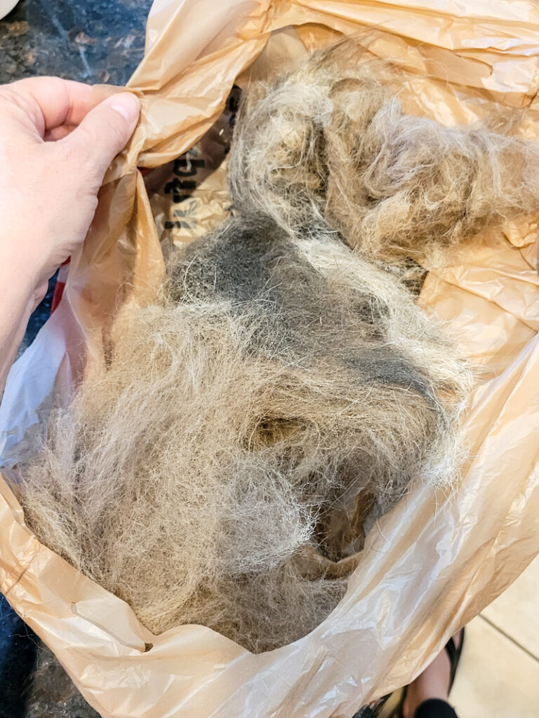 The best tools to reduce pet fur in your home on floors, carpet and furniture. These are the tools and products I found best to help manage pet shedding and hair in our home. It takes a few items mixed together to get pet hair under control and manageable in your house! #pethair #shedcontrol #doghair #furcontrol