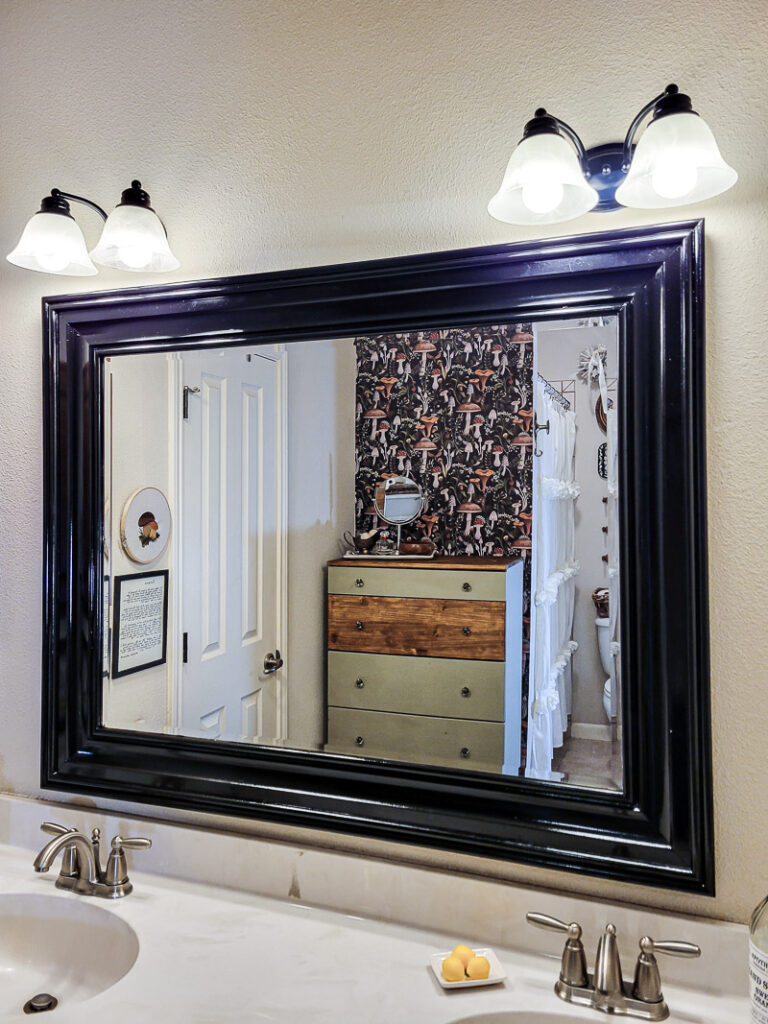 If you are looking for some budget bathroom makeover ideas you can finish in a day, these easy ideas are for you. Use what you have and give your bathroom a facelift with a small budget.One of the easiest bathroom updates is to paint light fixtures, it's such a cheap bathroom update anyone can do. #paintedlightfixture #spraypaintmakeover #budgetlighting